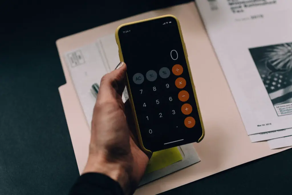 A person holding a calculator.